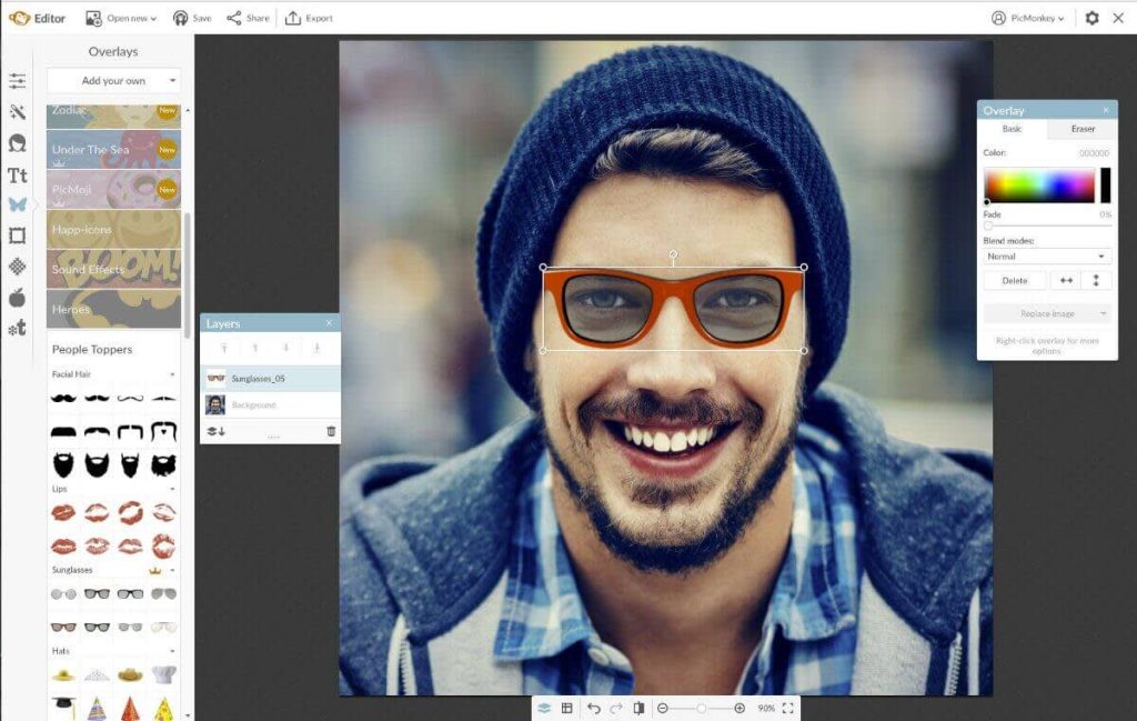 Photo editing software interface showing a smiling man wearing a beanie, with sunglasses being added as an overlay using editing tools and layers.