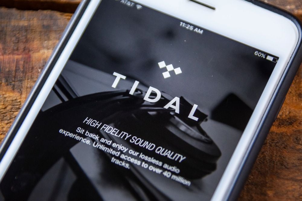 A smartphone screen showing the TIDAL music streaming app with the words “High Fidelity Sound Quality” visible.