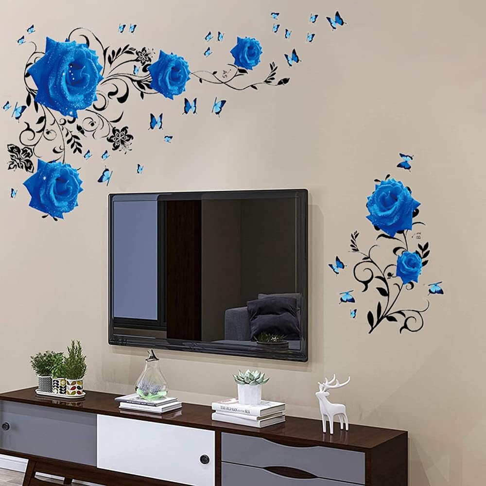 Wall-mounted TV with blue rose, butterfly, and black vine decals decorating the surrounding wall.