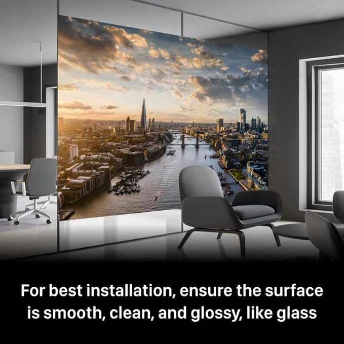 A large wall projection screen shows a city skyline in a modern room with text advising installation on a smooth, clean, glossy surface.
