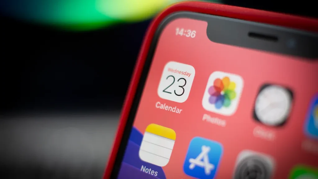 A close-up of iPhone home screen with apps and photos icon highlighting everyday smartphone use.