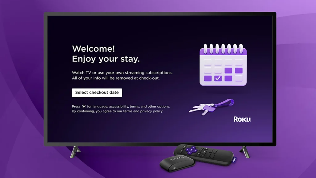 Roku TV displaying Guest Mode welcome screen with a remote and streaming stick in front.