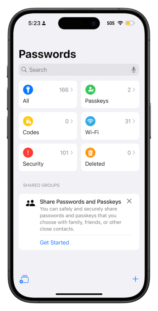 iPhone settings screen showing the built-in Passwords feature with categories like passkeys, Wi-Fi, and security alerts.