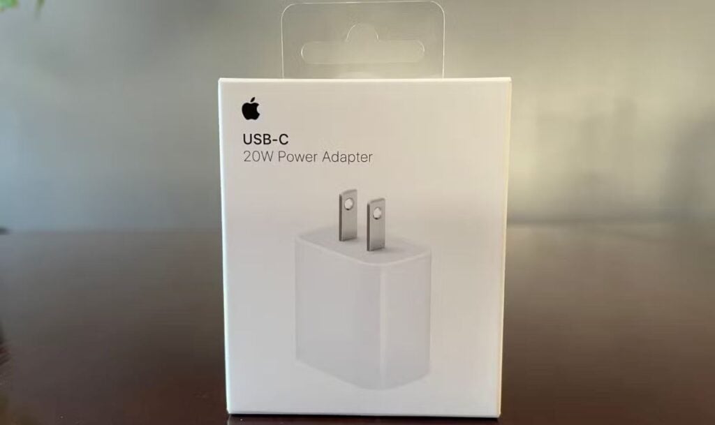 Apple 20W USB-C power adapter box displayed on a table