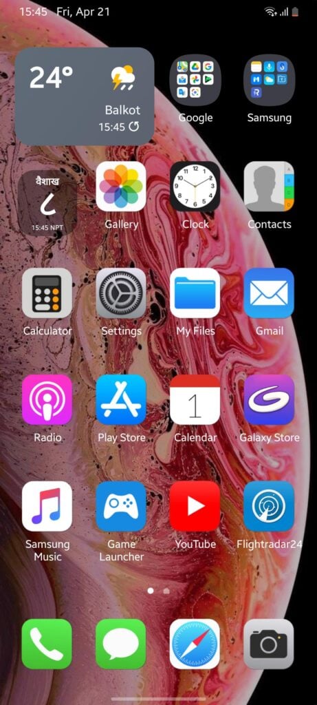 A Samsung phone home screen customized with iPhone-style app icons, widgets, and dock layout over a red abstract wallpaper.